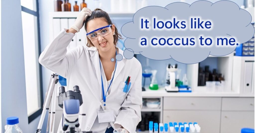 A woman is puzzled in front of a microscope.
